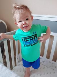 Toddler standing in his crib