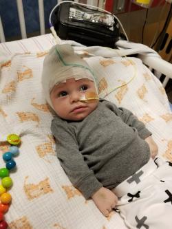 Baby in hospital crib