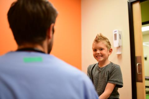 Boy in exam room with provider