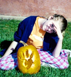 Girl with carved pumpkin