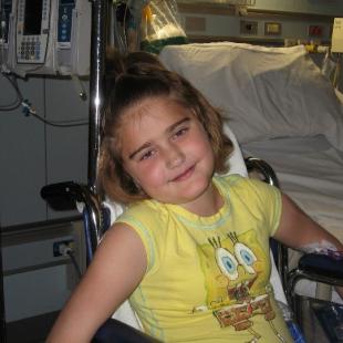 Girl in wheelchair, in hospital room
