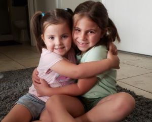Two sisters hugging