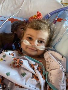 Toddler in hospital bed during treatment