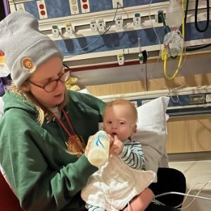 Mother holding infant in hospital