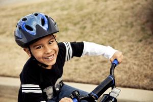 Boy wearing helmet on bicycle