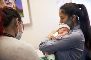 Mother and newborn at provider appointment