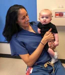 Doctor holding infant