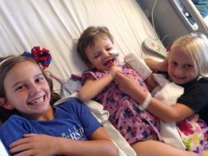 3 girls in hospital bed