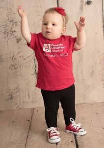 Toddler in red Phoenix Children's t-shirt
