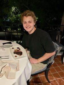 Teen sitting at table before dinner