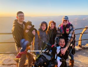 Family of 6 posing at Grand Canyon