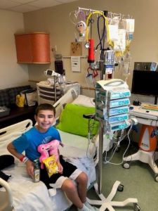 Child sitting in hospital bed