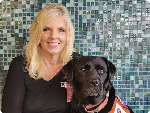 Lisa and animal therapy dog, Checkers