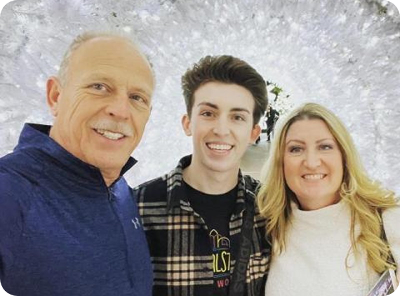 Parents and teenage son smiling