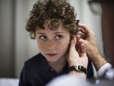 Boy getting his ears checked