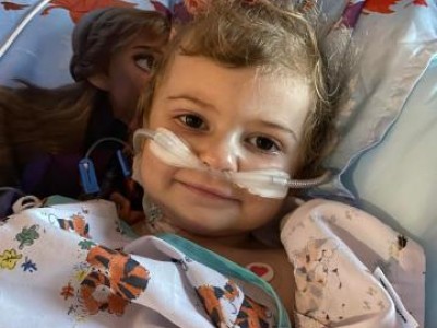 Toddler in hospital bed during treatment