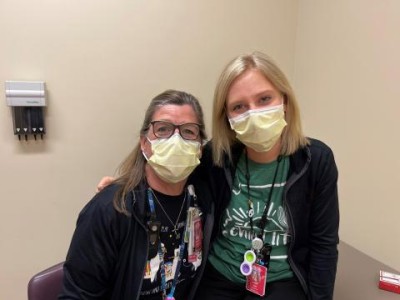 Two providers wearing face masks