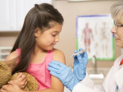 Young girl getting immunized