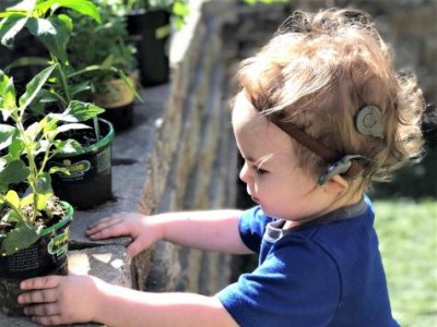 Toddler wearing cochlear implant