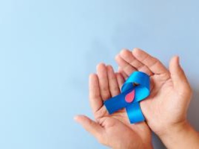 Two hands holding a blue ribbon