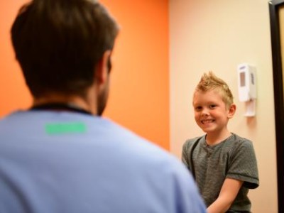 Boy in exam room with provider