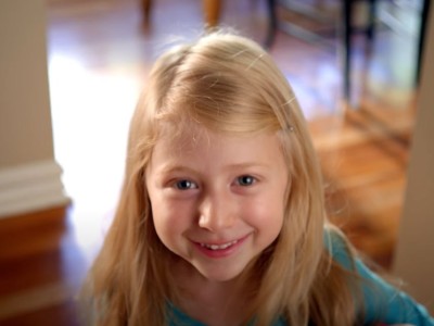 Young girl smiling at camera
