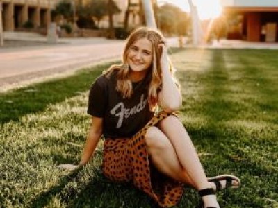 Teen girl sitting in the grass