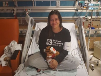 Teen girl in hospital bed