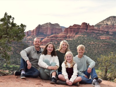Family smiling in Arizona landscape