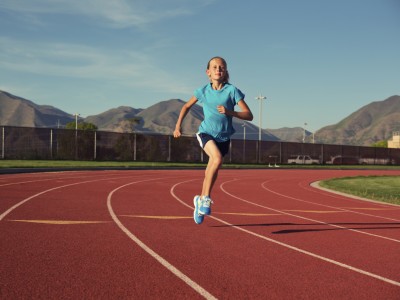 Girl running on track