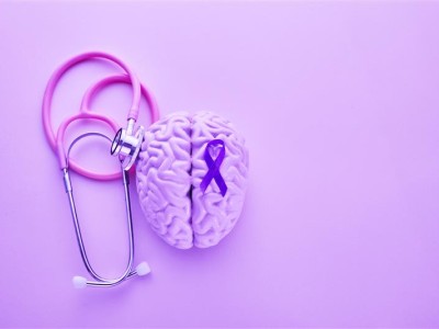 Image of brain, stethoscope and purple ribbon for Epilepsy Month
