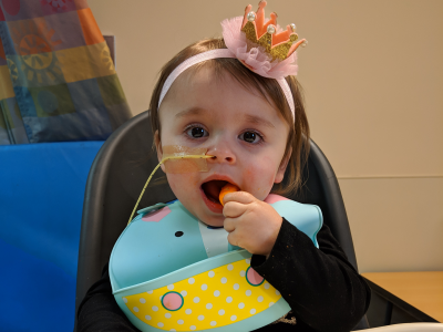 Child with NG tube, feeding herself