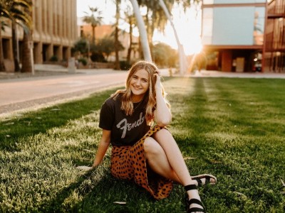 Teen girl sitting in the grass