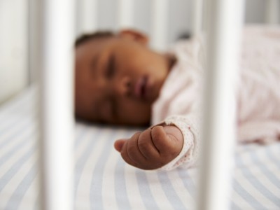 Infant sleeping in crib