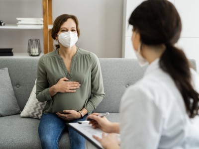 Pregnant woman meeting with provider