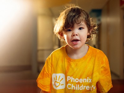 Child in yellow Phoenix Children's shirt