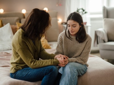 Teen holding mothers hands