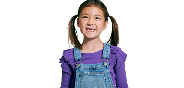 Child with pigtails smiling