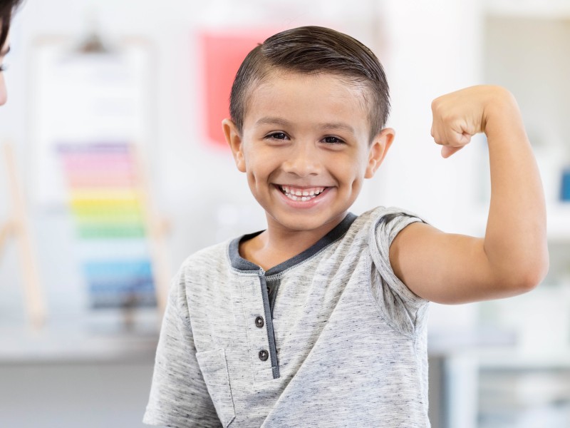 Boy making a muscle