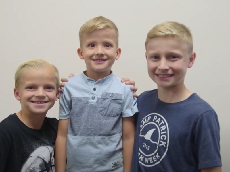 Three boys posing together