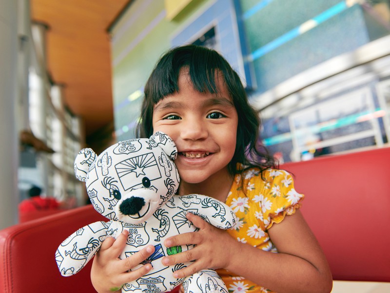 cute girl holding bear