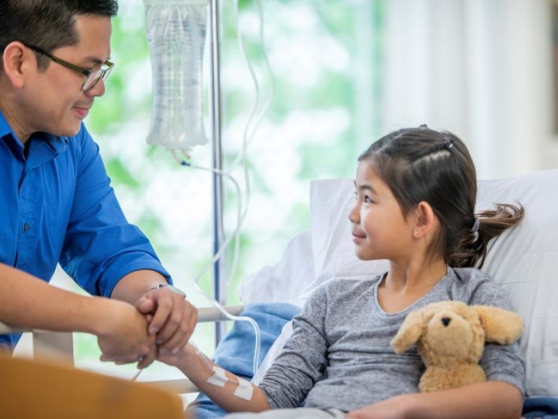 Girl in hospital bed