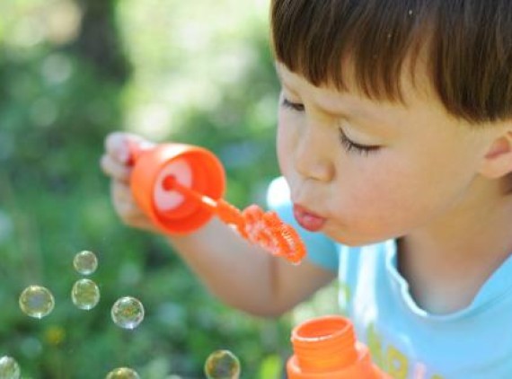 Child blowing bubbles