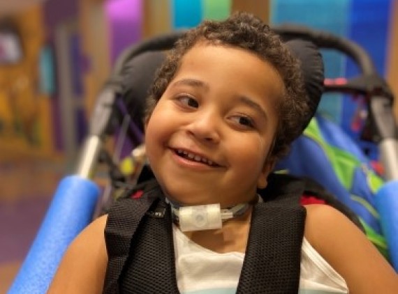 Smiling boy in stroller