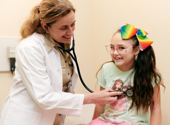 Doctor listening with stethoscope