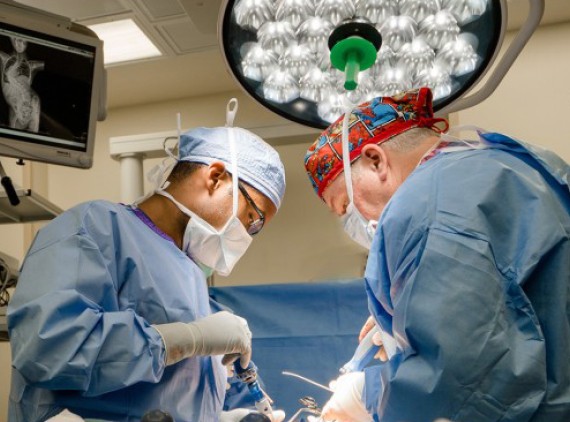 Doctors performing spine surgery