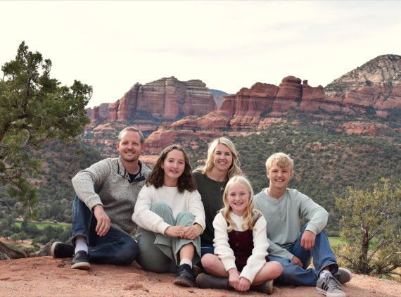 Family smiling in Arizona landscape