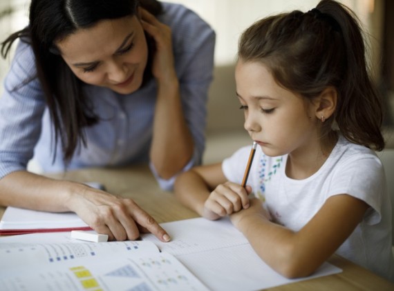 Parent and child working on schoolwork