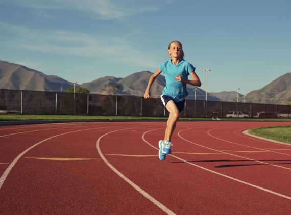 Girl running on track