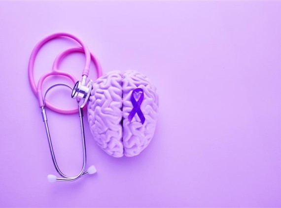 Image of brain, stethoscope and purple ribbon for Epilepsy Month